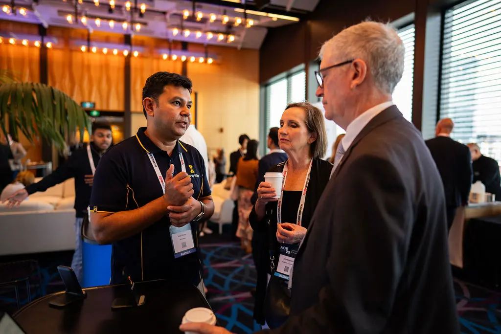SavvyWise co-founder speaking with conference attendees